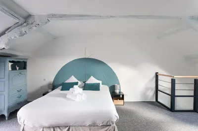 Un ou plusieurs lits dans un hébergement de l'établissement Désirée - Appartement en duplex à quelques pas du port
