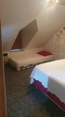 Un ou plusieurs lits dans un hébergement de l'établissement Gîte campagnard 11 personnes