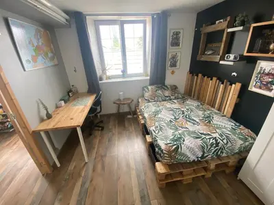 Un ou plusieurs lits dans un hébergement de l'établissement Petite maison de campagne