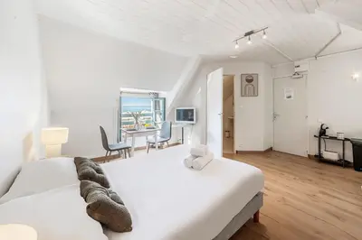 Un ou plusieurs lits dans un hébergement de l'établissement Bord de l'eau 5 - Studio - Sea view
