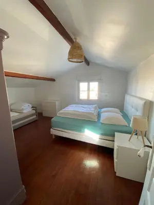 Un ou plusieurs lits dans un hébergement de l'établissement BEAU DUPLEX 80 m2 100 metre de la plage