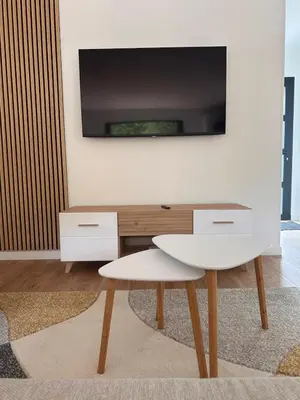 Télévision ou salle de divertissement dans l'établissement Le Balleré - Gîtes du Bessin