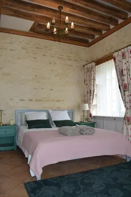 Un ou plusieurs lits dans un hébergement de l'établissement Château de Canon - le Logis d'Antoinette