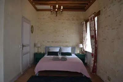 Un ou plusieurs lits dans un hébergement de l'établissement Château de Canon - le Logis d'Antoinette