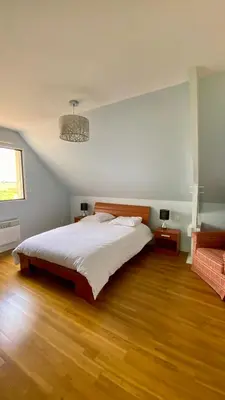 Un ou plusieurs lits dans un hébergement de l'établissement Maison grand confort à 100 m de la plage
