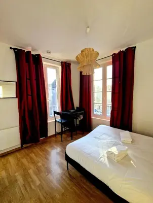 Un ou plusieurs lits dans un hébergement de l'établissement Logement élégant au cœur de CAEN