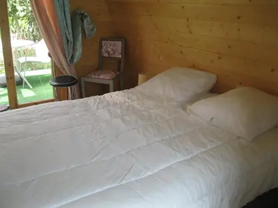 Un ou plusieurs lits dans un hébergement de l'établissement Chalet fleuri