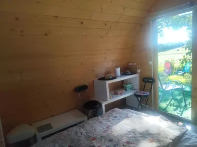 Un ou plusieurs lits dans un hébergement de l'établissement Chalet fleuri