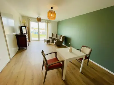 Coin salon dans l'établissement Studio dans résidence avec salon et cuisine partagés - 402