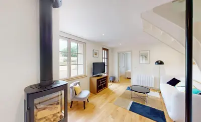 Télévision ou salle de divertissement dans l'établissement Au bord de l'Odon