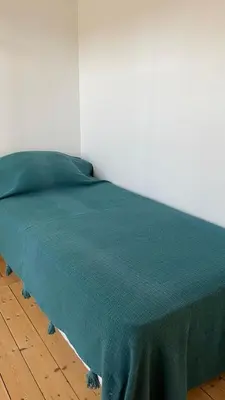 Un ou plusieurs lits dans un hébergement de l'établissement Petite maison plage et port de plaisance à pied