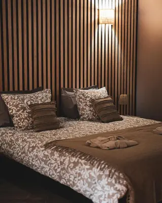 Un ou plusieurs lits dans un hébergement de l'établissement Love Room L'Entre Deux