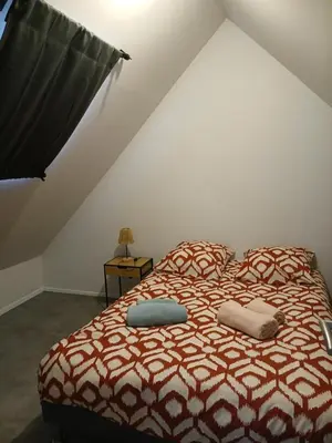 Un ou plusieurs lits dans un hébergement de l'établissement Maison de charme