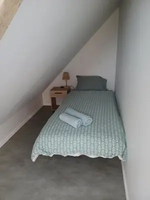 Un ou plusieurs lits dans un hébergement de l'établissement Maison de charme