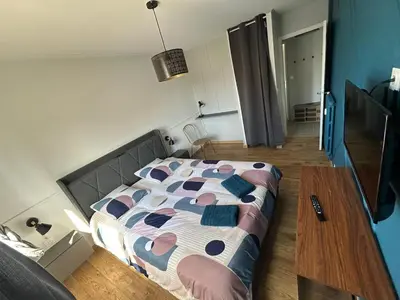 Un ou plusieurs lits dans un hébergement de l'établissement T2 moderne proche centre avec balcon et wifi