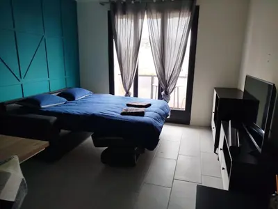 Un ou plusieurs lits dans un hébergement de l'établissement T2 moderne proche centre avec balcon et wifi