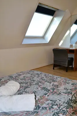 Un ou plusieurs lits dans un hébergement de l'établissement Villa des Perelles