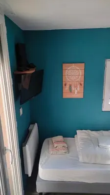 Un ou plusieurs lits dans un hébergement de l'établissement Maison bord de mer