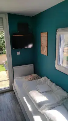 Un ou plusieurs lits dans un hébergement de l'établissement Maison bord de mer