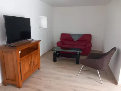Télévision ou salle de divertissement dans l'établissement Gîte