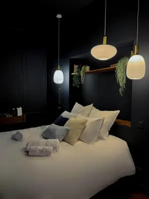 Un ou plusieurs lits dans un hébergement de l'établissement Suite Romantique, hyper centre