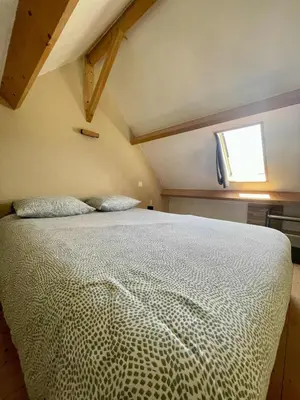 Un ou plusieurs lits dans un hébergement de l'établissement Le petit Chalet