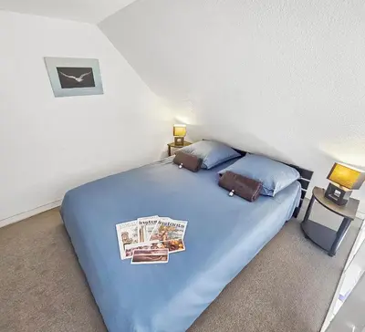 Un ou plusieurs lits dans un hébergement de l'établissement Duplex vue mer, balcon, parking privé