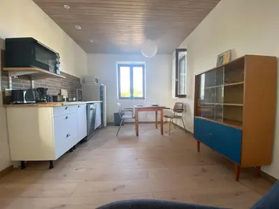 Cuisine ou kitchenette dans l'établissement Charmant appartement Carolles