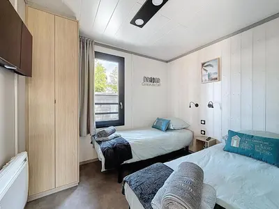 Un ou plusieurs lits dans un hébergement de l'établissement Cottage Le Béluga