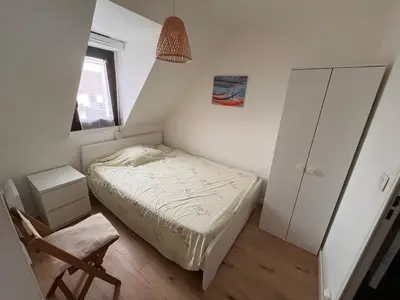 Un ou plusieurs lits dans un hébergement de l'établissement Appartement Cabourg Plage - F2 - Vue dégagée