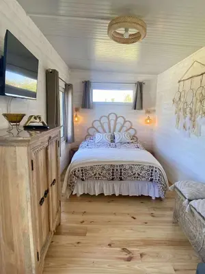 Un ou plusieurs lits dans un hébergement de l'établissement Mimi's tiny house