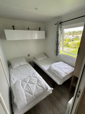 Un ou plusieurs lits dans un hébergement de l'établissement Bungalow tout confort 6 personnes
