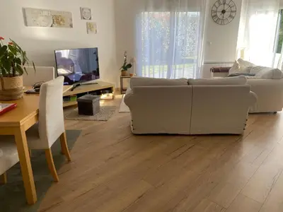 Télévision ou salle de divertissement dans l'établissement Grande maison avec jardin bayeux