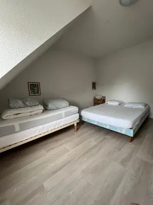 Un ou plusieurs lits dans un hébergement de l'établissement Maison de vacances accès direct plage residence sécurisée