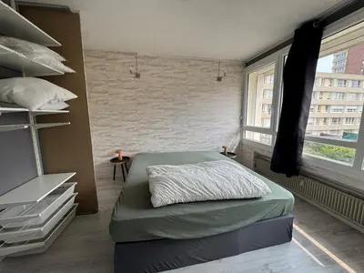 Un ou plusieurs lits dans un hébergement de l'établissement Appartement Hérouville