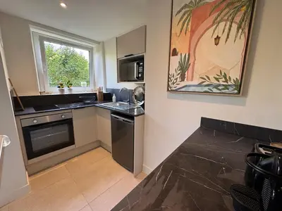 Cuisine ou kitchenette dans l'établissement Appartement Caen proche Gare