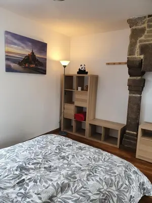 Un ou plusieurs lits dans un hébergement de l'établissement Appartement de la cour du Haut Manoir