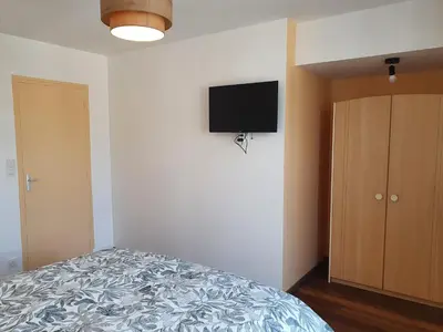 Un ou plusieurs lits dans un hébergement de l'établissement Appartement de la cour du Haut Manoir