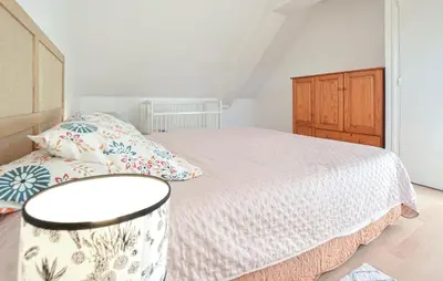 Un ou plusieurs lits dans un hébergement de l'établissement Maison Entre Terre Et Mer