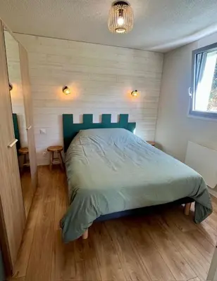 Un ou plusieurs lits dans un hébergement de l'établissement Appartement vue mer avec accès direct à la plage