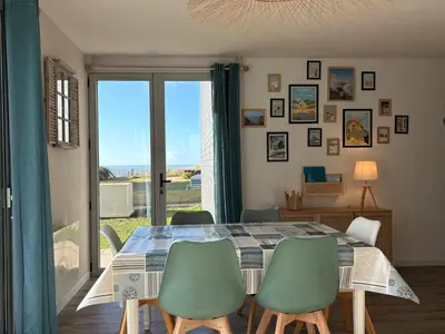 Coin salon dans l'établissement Appartement vue mer avec accès direct à la plage