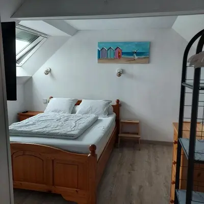 Un ou plusieurs lits dans un hébergement de l'établissement Petite maison de vacances