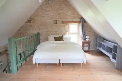 Un ou plusieurs lits dans un hébergement de l'établissement Cottage Maison Areli