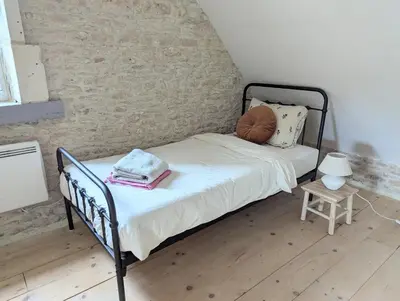 Un ou plusieurs lits dans un hébergement de l'établissement Cottage Maison Areli