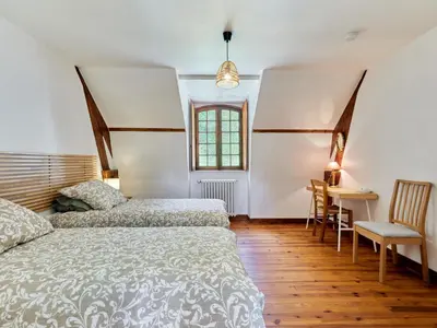 Un ou plusieurs lits dans un hébergement de l'établissement Holiday Home Le Pressoir de la laize by Interhome