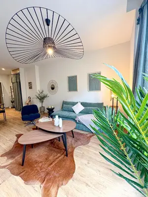 Coin salon dans l'établissement Appart City break Chic Cosy Wifi Caen Hyper centre