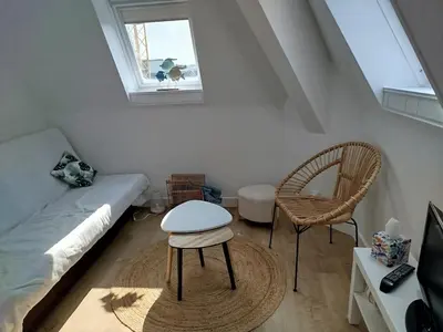 Coin salon dans l'établissement Appartement avec accès a la plage