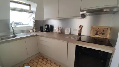 Cuisine ou kitchenette dans l'établissement Appartement avec accès a la plage