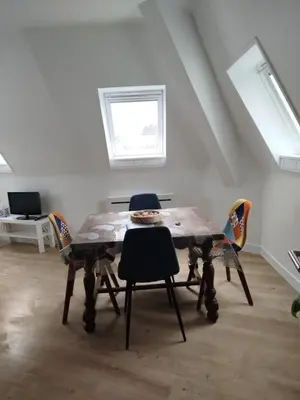 Télévision ou salle de divertissement dans l'établissement Appartement avec accès a la plage