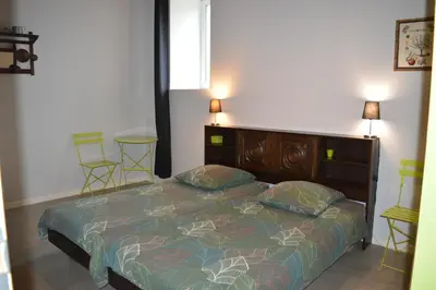 Un ou plusieurs lits dans un hébergement de l'établissement Ma maison de famille, grange du 18e siècle, jardin